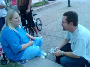 brad sitting and sharing the gospel with young lady