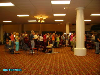 A unified assembly of over a hundred believers gathered for outreach training.